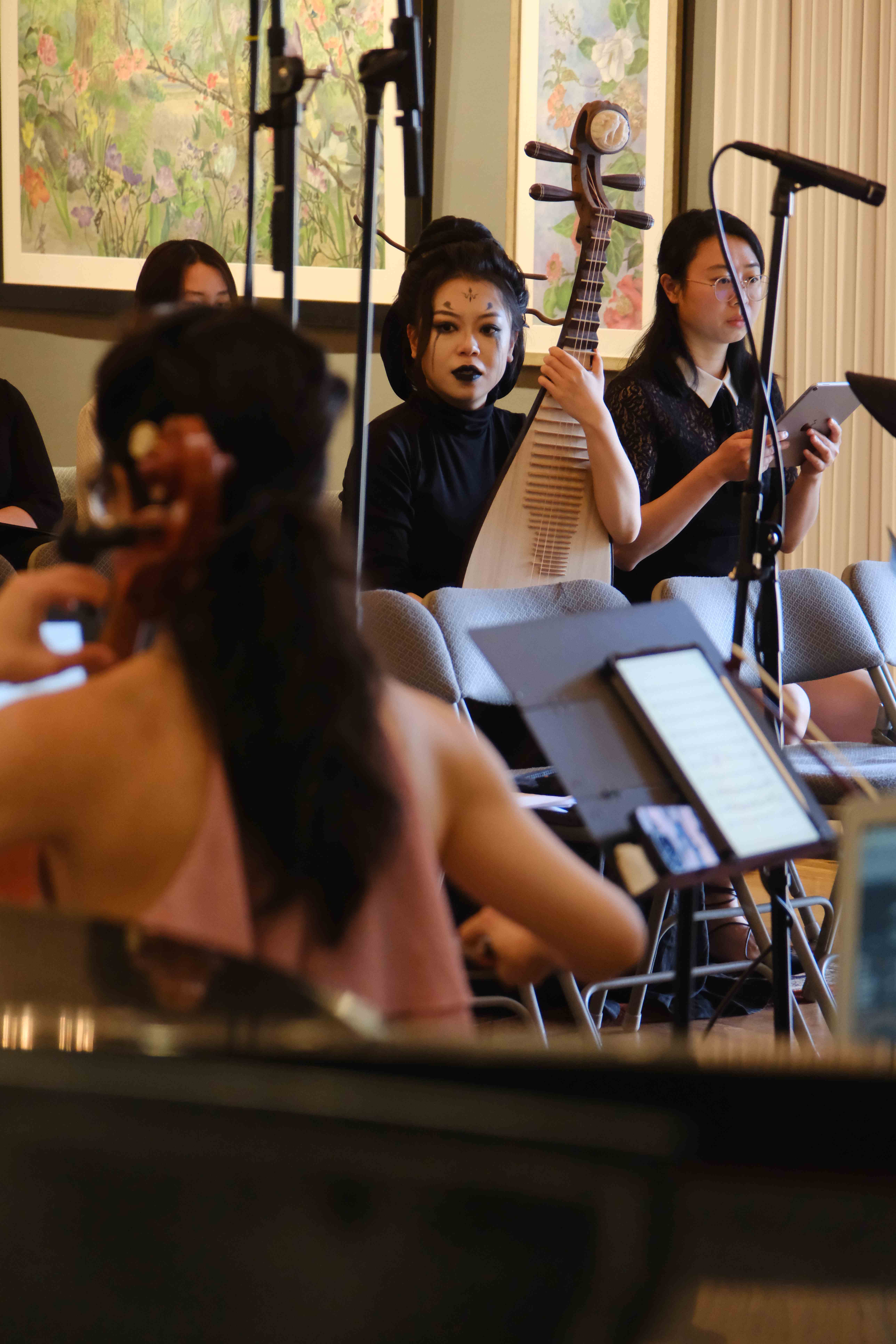 Pipa player with artistic makeup performing traditional Chinese music